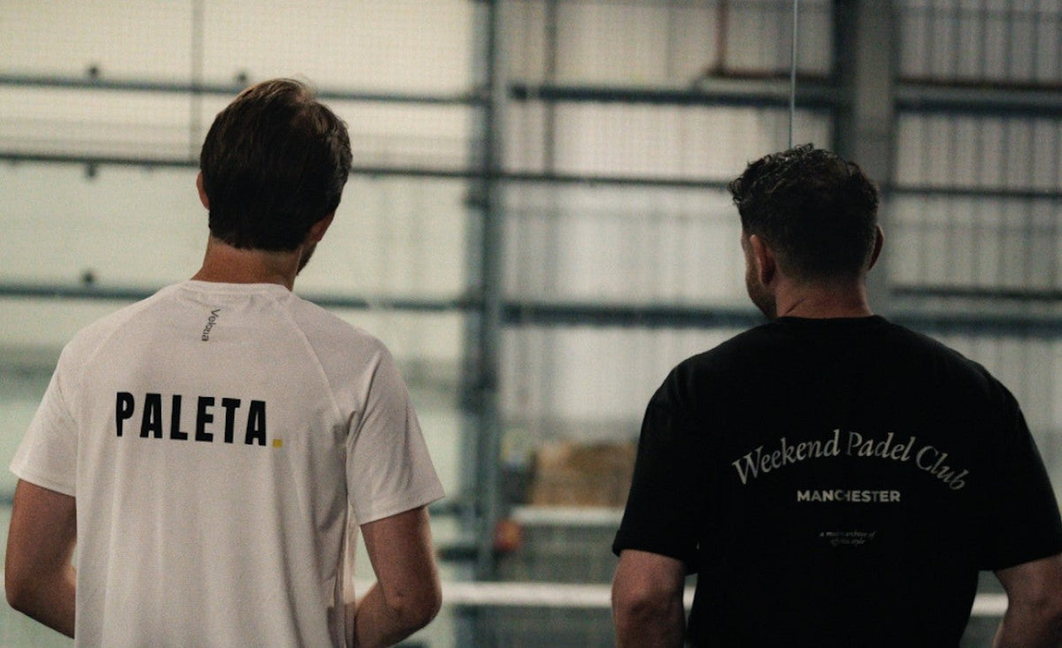 Two players courtside, one in a Weekend Padel Club Manchester tee